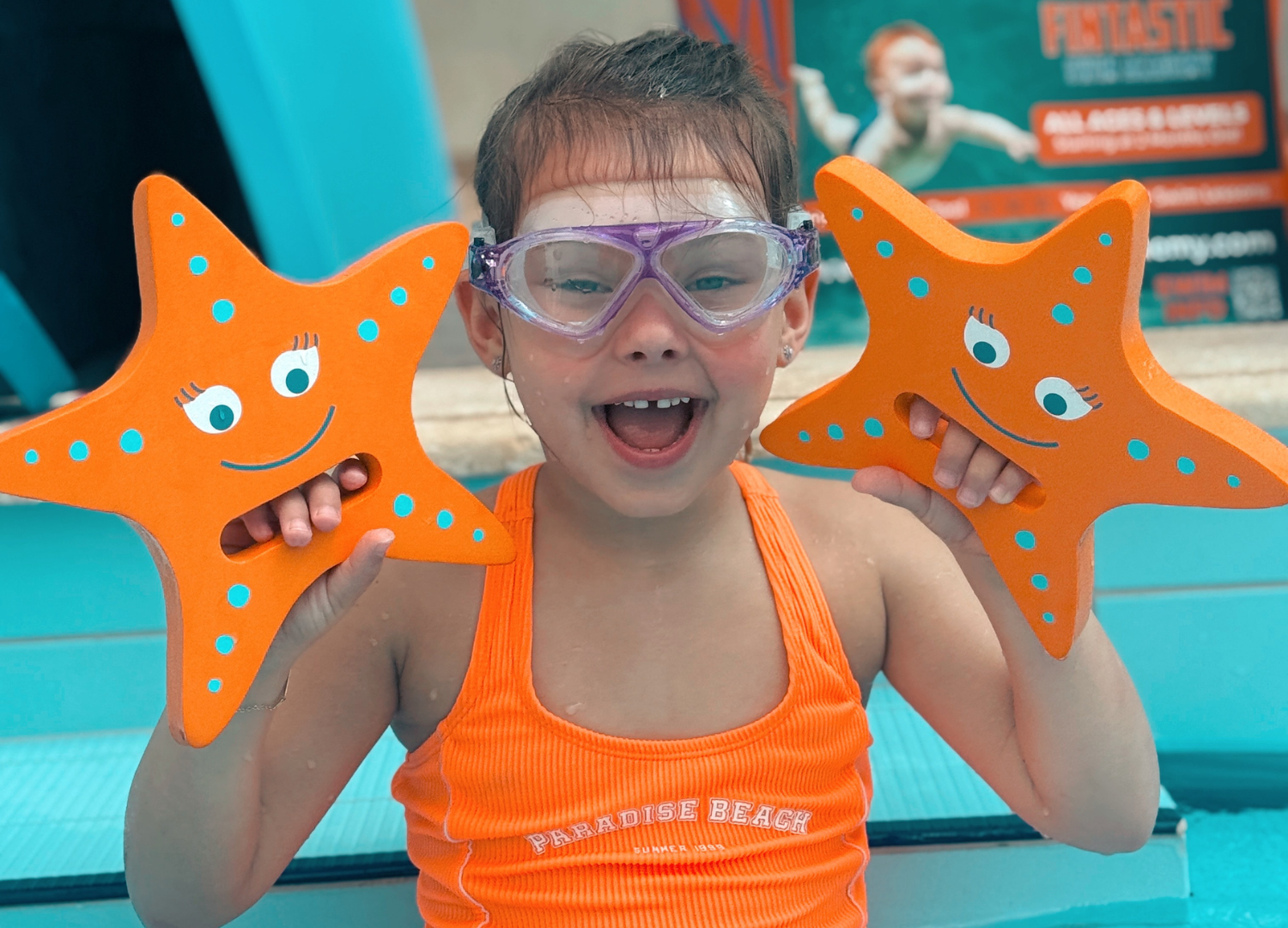 Baby boy dives underwater in the pool with pleasure